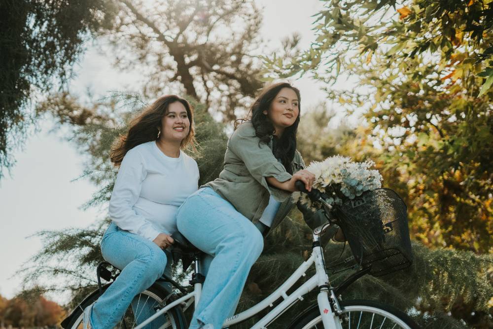 Two females riding a bicycle